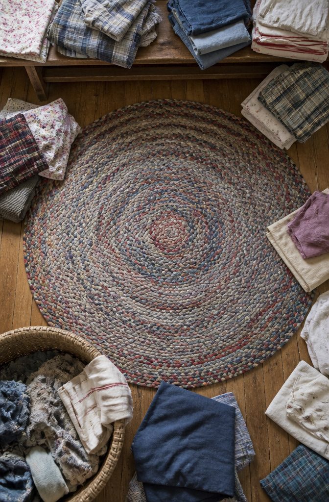 Braided rag rug made from assorted clothing and fabric scraps