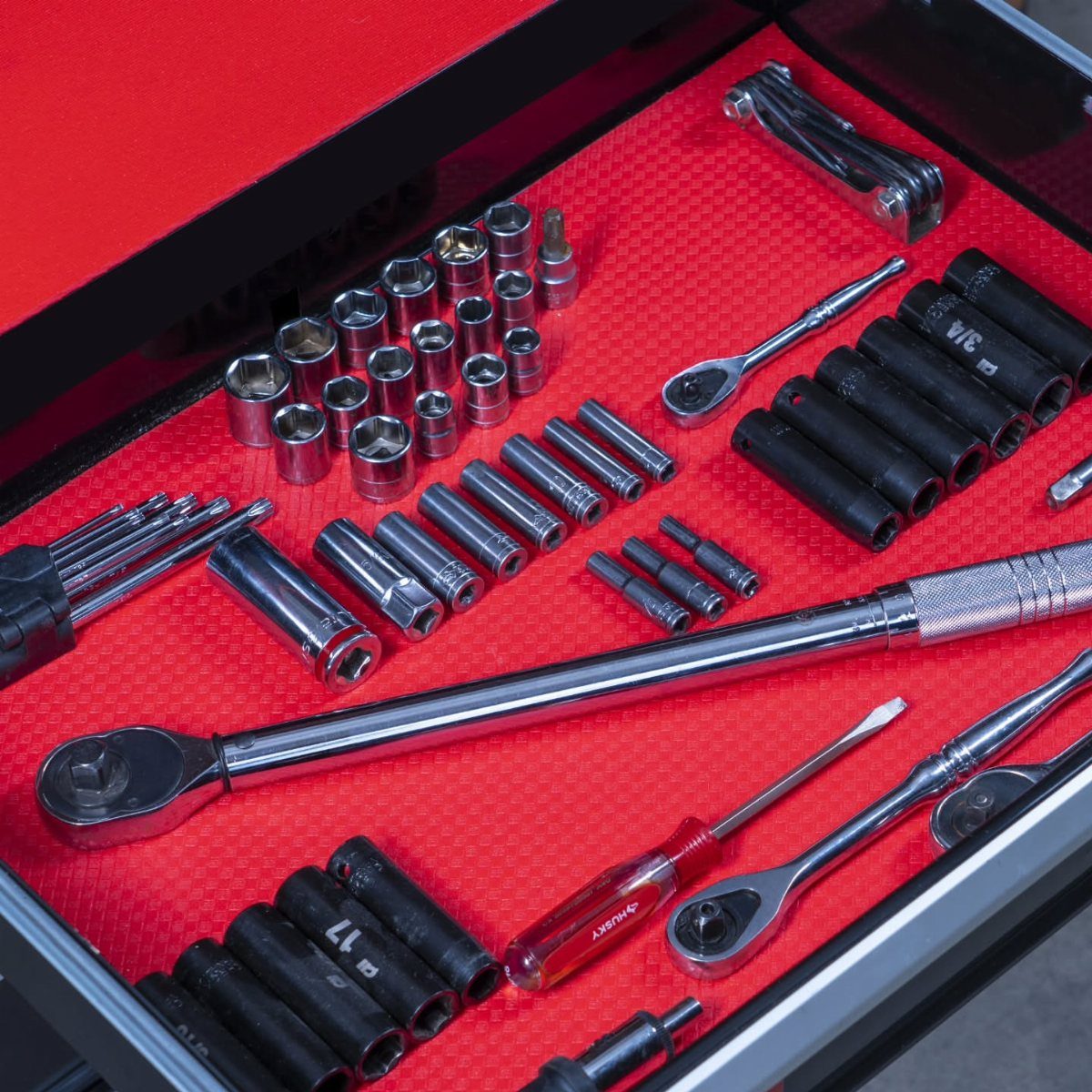 DIY Garage Organization: 17 Ideas to Build and Install 11 Organized tool drawer with sockets and wrenches on a red textured liner.