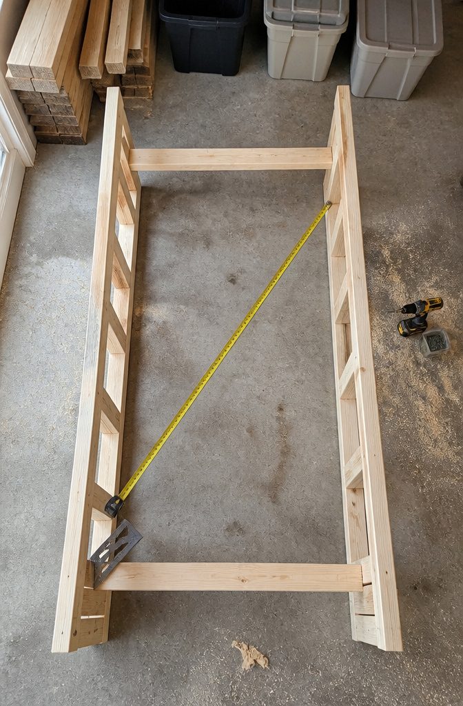 Assembled wooden tote rack frame before bins are loaded