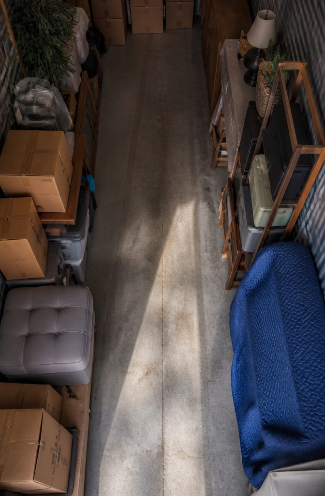 Storage unit with rows of boxes separated by a clear center walkway
