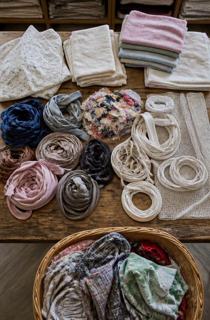 How to Sew a Rug: 9 Steps for Cotton Piping and Fabric Rugs 10 Assorted old clothes, household textiles, cotton piping, and fabric scraps