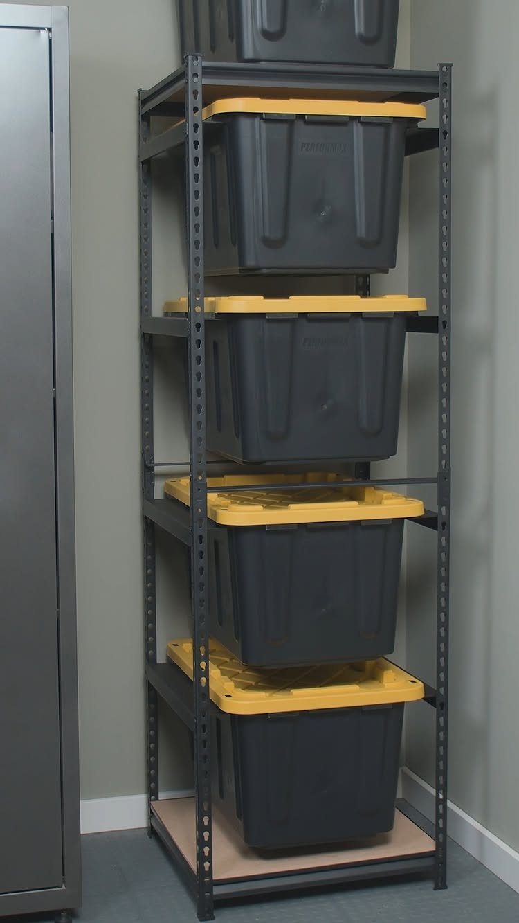 Grey metal shelving unit holding five grey plastic storage totes with yellow lids.