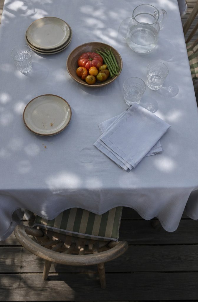 14 Ways to Reuse Ripped Sheets Instead of Throwing Them Out 10 Folded cotton napkins cut from a sheet beside a casual table setting